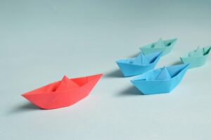 paper boats representing leadership